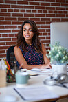 Business woman looking out window thinking of ideas planning ahead in office sitting at desk