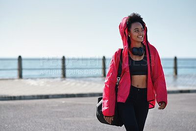 Buy stock photo Teenager, girl and thinking with fitness on promenade, gym gear or duffel with equipment for sports practice. African athlete, vision and sportswear with training bag, happy and headphones outdoor