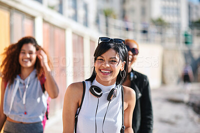 Buy stock photo Portrait, woman and walk in city with friends, bonding together or relax outdoor on weekend break. Summer, female person and hangout in urban town with people, wellness or smile for positive attitude