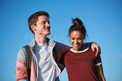 Buy stock photo Couple, hug and walk with smile on break, love and travel together on holiday and laugh with partner. Outdoor, blue sky and happy people on weekend, commitment and embrace with spouse on vacation
