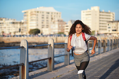 Buy stock photo Fitness, running or woman with exercise on boardwalk, endurance training or cardio routine for health. Promenade, commitment or athlete with distance challenge for wellness, morning workout or jog