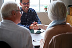 senior couple shaking hands with financial advisor for successful retirement advice 