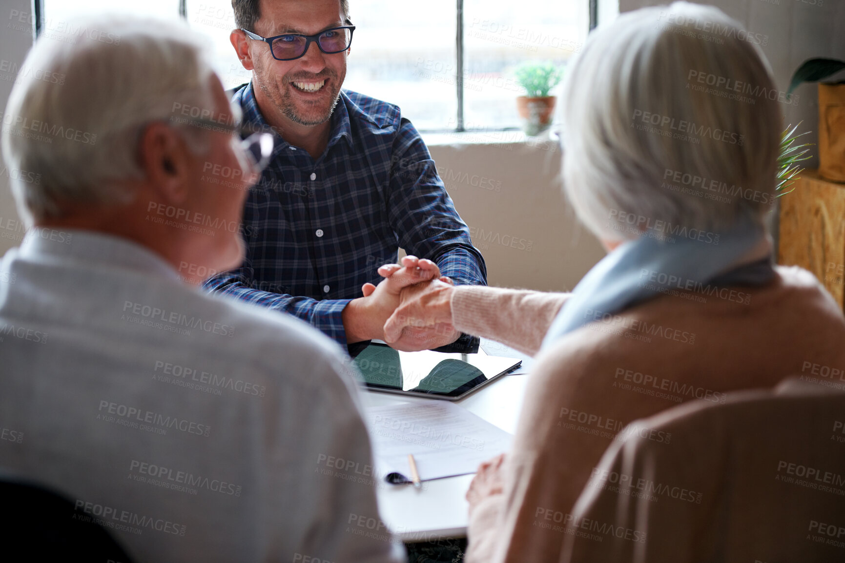 Buy stock photo Old couple, financial advisor and handshake for agreement, deal and retirement home planning. Senior man, woman and meeting for pension fund, loan agent and shaking hands for budget or investment