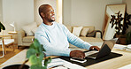 Thinking, laugh and black man on laptop for remote work, finance report and accounting in home. Freelance, happy and person on computer for financial review, proposal and research for wfh career