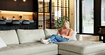 Journal, writing and senior woman on sofa with reminder, ideas and planning day in living room. Happy, retirement and elderly person with notebook for hobby, diary entry and inspiration in home