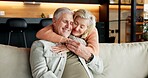 Hug, home and senior couple with smile, laughing and connection with partner on break and affection. Happy, mature people and bonding on weekend, comfortable and commitment for relationship in house