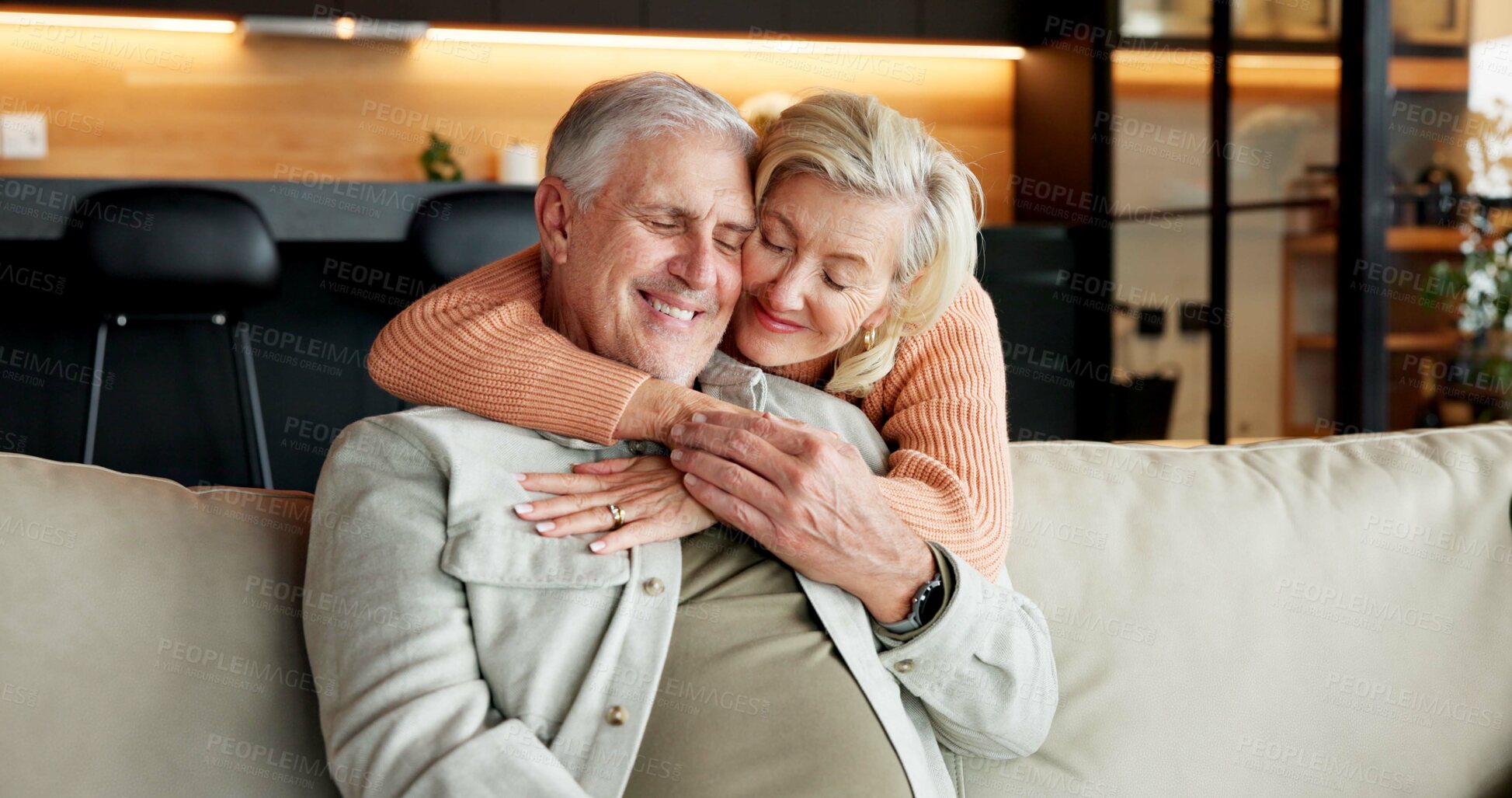 Buy stock photo Hug, home and senior couple with smile, laughing and connection with partner on break and affection. Happy, mature people and bonding on weekend, comfortable and commitment for relationship in house