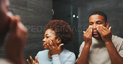 Buy stock photo Skincare, black couple and cosmetics in bathroom with mirror, glow and facial treatment for hydration. Man, woman and reflection for dermatology with beauty, wellness or collagen with lotion in home