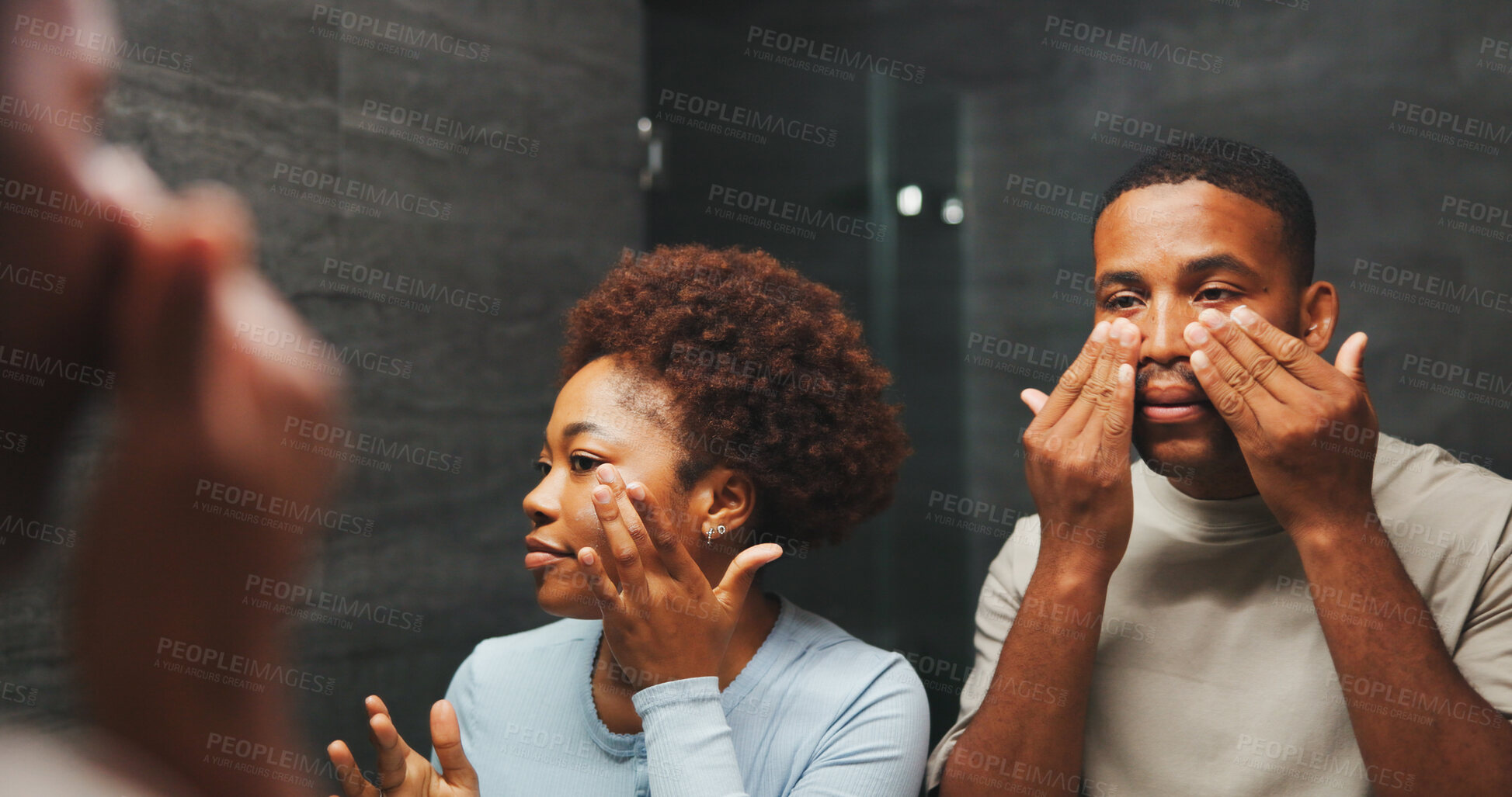 Buy stock photo Skincare, black couple and cosmetics in bathroom with mirror, glow and facial treatment for hydration. Man, woman and reflection for dermatology with beauty, wellness or collagen with lotion in home