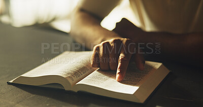Buy stock photo Hand, prayer and bible with man in kitchen for worship, spiritual study or Christian religion. Faith, gospel and inspiration with person and book at home for Jesus Christ, catholic and scripture