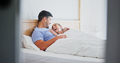 Buy stock photo Laughing, smile and relax with couple in bedroom of home for bonding, support and connection. Trust, romantic partner and happiness with man and woman in bed in house for wellness, joke and loyalty 