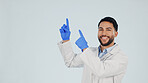 Scientist, portrait or man pointing up in studio for marketing or presentation on a white background. Male person, healthcare worker or showing mockup space with smile for advertising, list or option