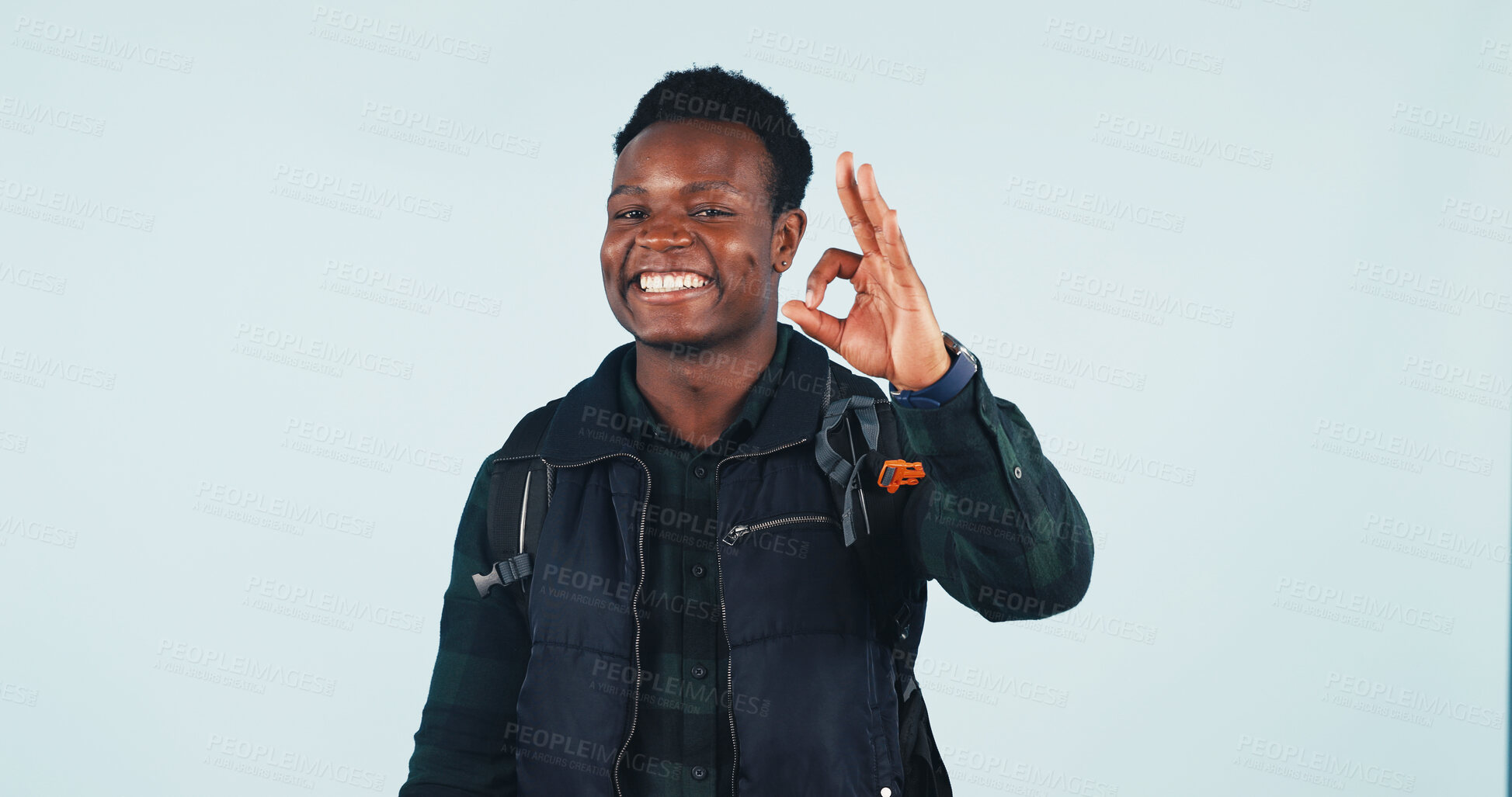 Buy stock photo Okay sign, portrait and man in studio for hiking, trekking and approval for adventure with space. Mockup, emoji and African person with success, yes and agreement for backpacking on white background 