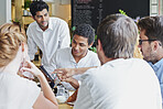 Creative, people and remote work in cafe with tablet, brainstorming and discussion for advertising. Freelancer, team collaboration and talk in coffee shop with tech, marketing project and planning.