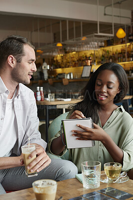 Buy stock photo Team, writing or remote work in cafe with notebook, ice coffee and plan for public relations startup. Freelancer, people and meeting notes in diner with drinks, diary and brainstorming for PR agency.