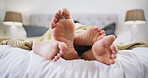 Feet, cuddle and couple with sleeping in bed, morning bonding and relax together for relationship. Foot, partner connection and people with support for comfort, resting and dream for peace in home