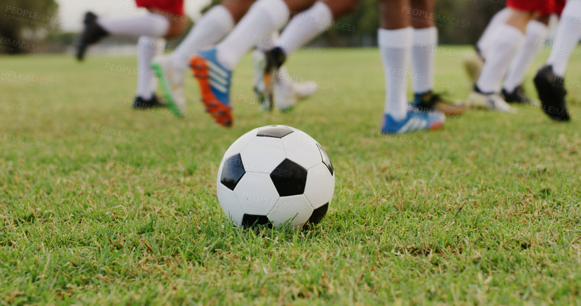 Buy stock photo People, feet and soccer ball on field with practice, outdoor training and preparation for tournament. Football player, team and shoes on grass with sports equipment, exercise and fitness for game.