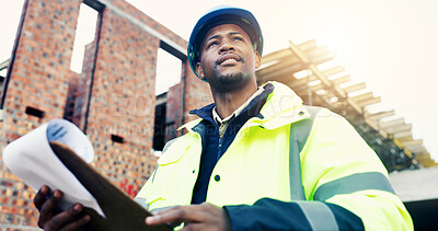 Buy stock photo Clipboard, black man and thinking with document on construction site with inspection for renovation or repairs. Low angle, smile and civil engineer with paperwork for project and risk assessment