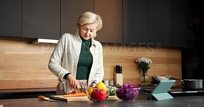 Buy stock photo Woman, cooking and vegetables in kitchen with tablet, recipe and meal prep for healthy food. Mature person, digital and online video at house with ingredients, culinary skills and tutorial for salad
