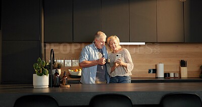 Buy stock photo Coffee break, phone and senior couple in home for morning, conversation or bonding together in kitchen. Love, tech and elderly people for discussion with social media, relax and chat in apartment
