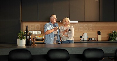 Buy stock photo Senior couple, coffee and talking in kitchen with mug, beverage and retirement. Apartment, reflection and elderly man and woman with discussion, herbal tea or communication with happiness in home