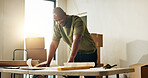 Happy, man and renovation with floor plan for home improvement, property upgrade or interior design. Black person, smile and layout document in house with blueprint, maintenance or remodeling project