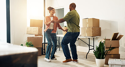 Buy stock photo Moving, couple and dancing in new home, love and bonding with partner or property investment success. African people, rhythm and celebration for first house, real estate and happy for relocation
