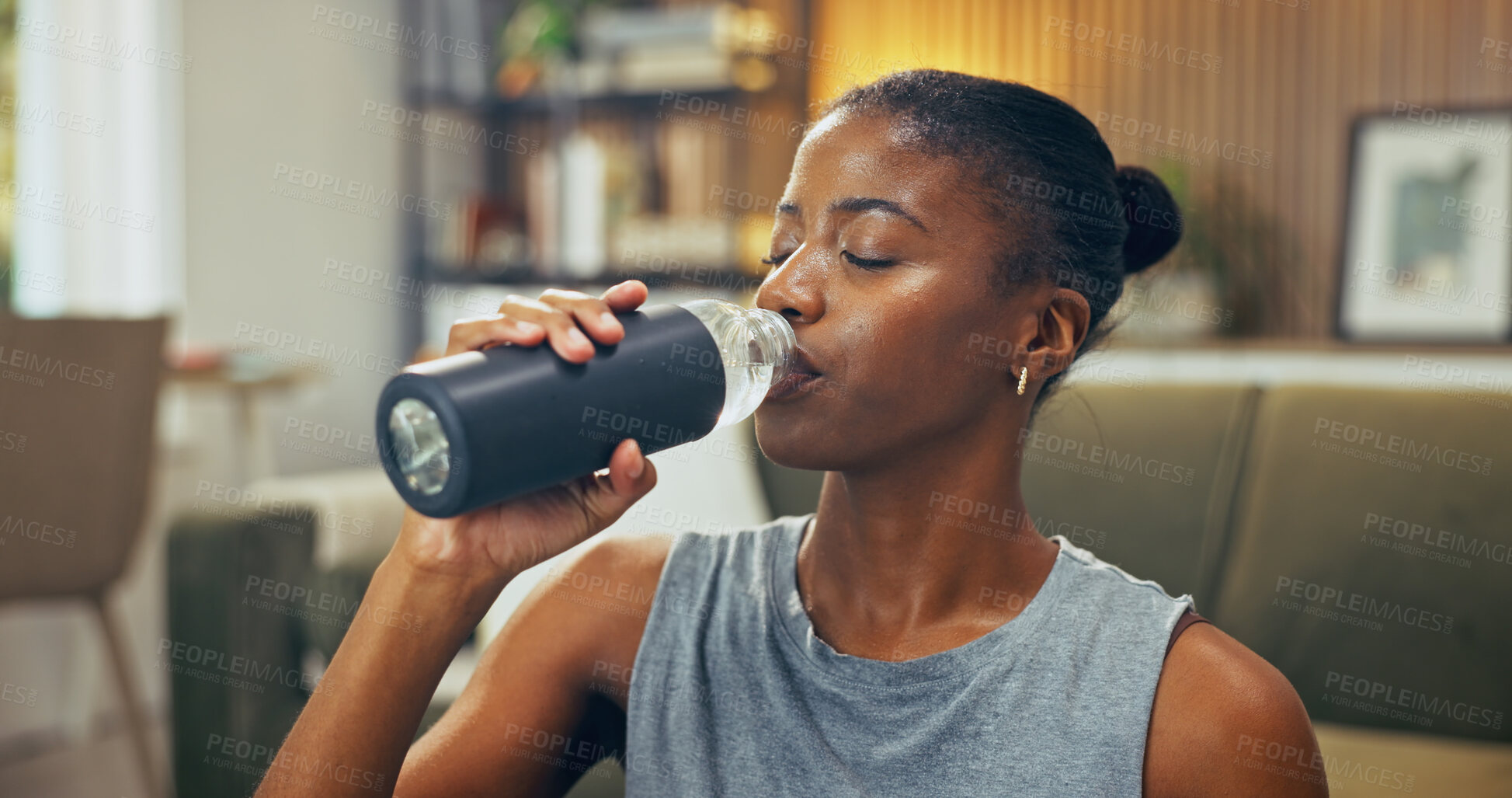 Buy stock photo Black woman, fitness and break with water for drink, hydration and wellness after exercise in home. Female person, workout rest and liquid bottle for h2o, detox and thirsty in apartment lounge