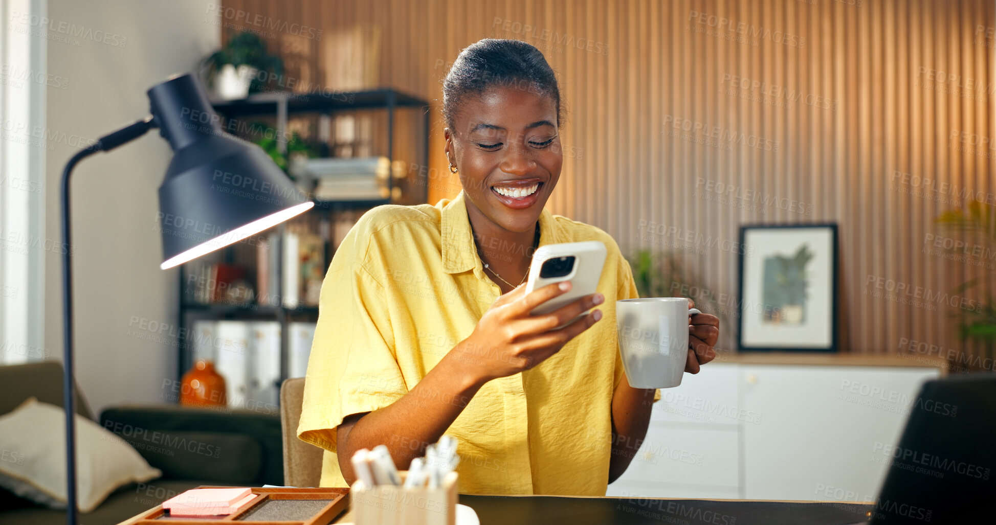 Buy stock photo Woman, laugh and phone in home with remote work, morning coffee and funny joke on social media post. Black person, browsing and happy in house with tech, freelance job and humor from text message.