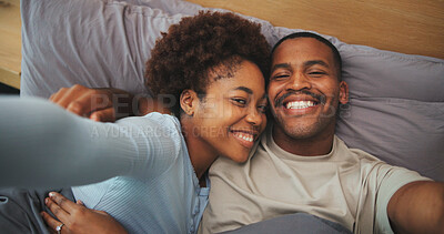 Buy stock photo Portrait, relax and selfie with black couple in bed at apartment together for bonding or connection. Affection, photograph and smile with happy people in bedroom of home for memories or social media