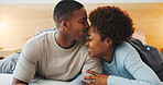 Kiss, love and smile with black couple in bed at apartment together for bonding, connection or rest. Affection, moment and wake up with happy people in bedroom of home for break, holiday or romance