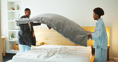 Buy stock photo Black couple, making bed and cleaning in home with help, support and partnership with smile. Woman, man and bedroom with sheet, blanket or duvet for housekeeping with teamwork for hygiene in house