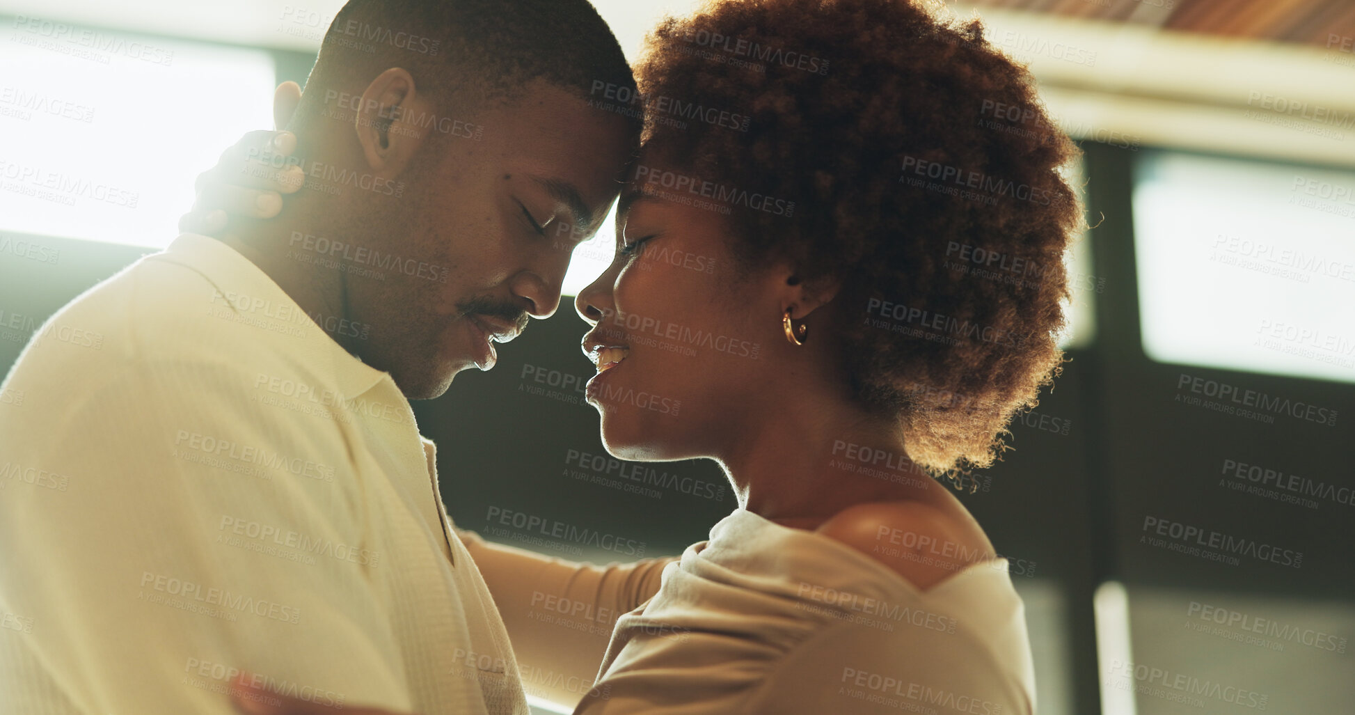 Buy stock photo Couple, hug and bonding with smile, home and commitment for relationship, support and forehead touch. Happy, black people and connection with partner on weekend, affection and romance in apartment