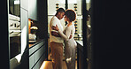 Couple, love and hug in kitchen with connection, bonding together and relax on weekend break in home. Space, married black people and embrace in house with relationship commitment, loyalty and care.