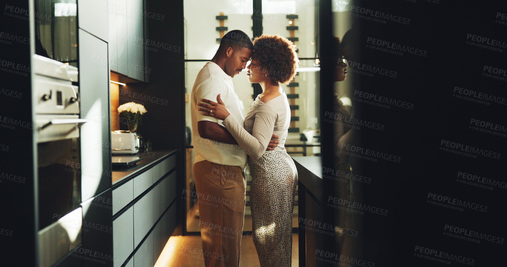 Buy stock photo Couple, love and hug in kitchen with connection, bonding together and relax on weekend break in home. Space, married black people and embrace in house with relationship commitment, loyalty and care.