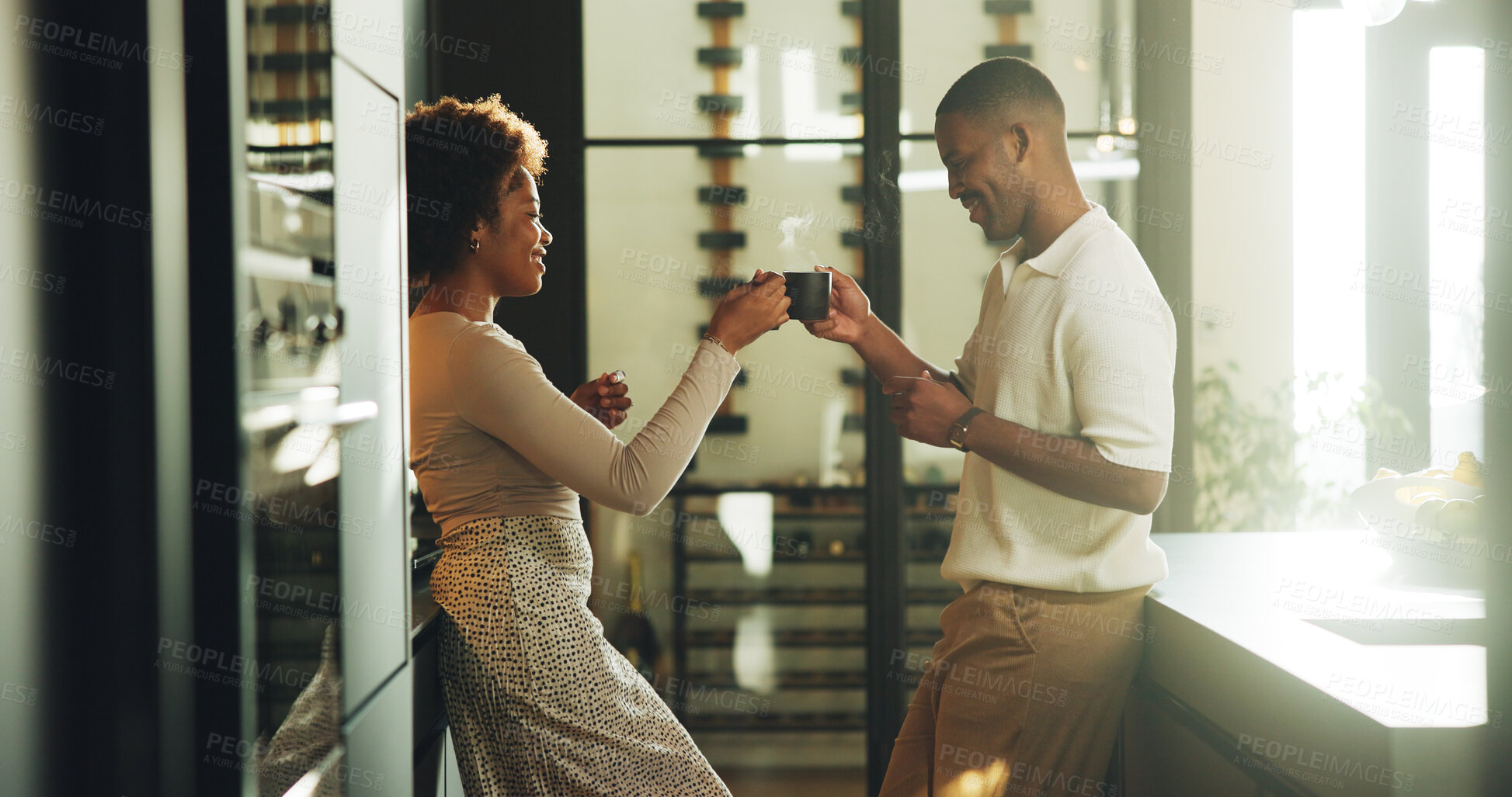 Buy stock photo Happy, couple and cheers in kitchen with coffee, bonding together and love for relationship commitment. Married, black people and toast in home with warm drink, care and connection on weekend break.