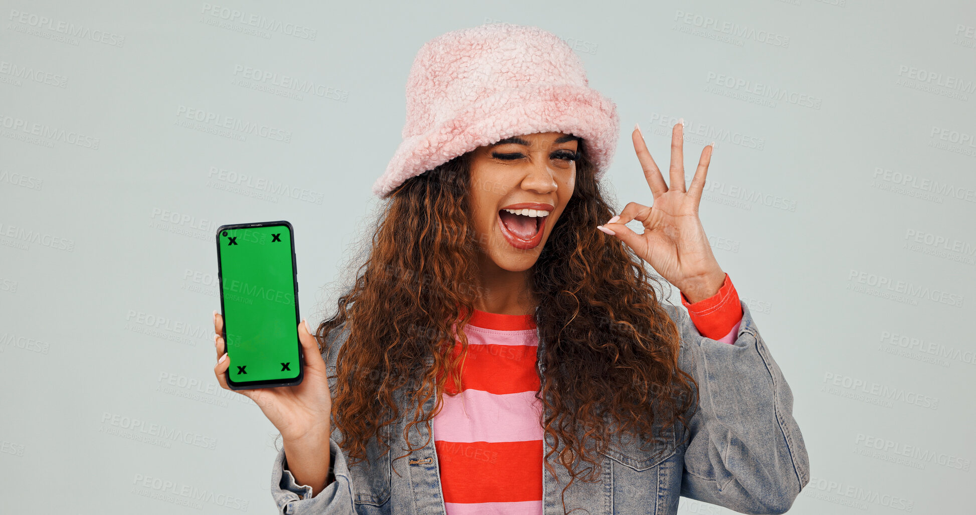 Buy stock photo Phone, wink or woman with good news, green screen or online shopping with okay emoji. Mockup space, digital or female person with portrait, positive feedback or product sale on studio background.