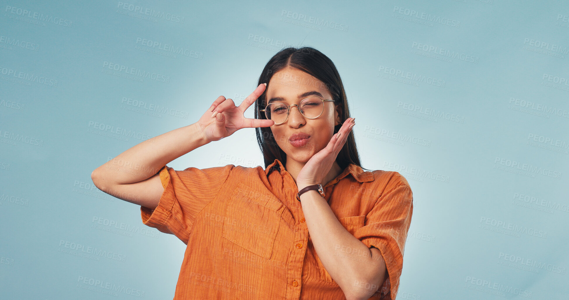 Buy stock photo Portrait, student and woman in studio with peace sign, fun personality or glasses for higher education. Person, pout and v gesture with creative college degree, good mood or space on blue background.