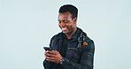 Happy, studio and black man with phone for travel, chat or communication on a blue background. Male person, traveler or smile with mobile smartphone for online texting, network or connection on space