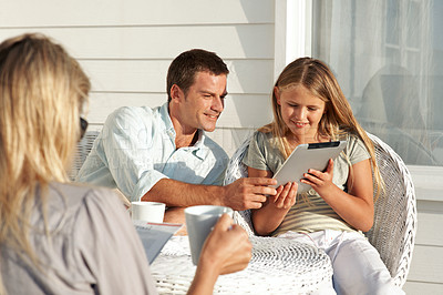 Buy stock photo Smile, father and child on patio with tablet, social media and browsing website for weekend. Happy, parents and daughter at home with digital, download games and reading ebook for bonding together