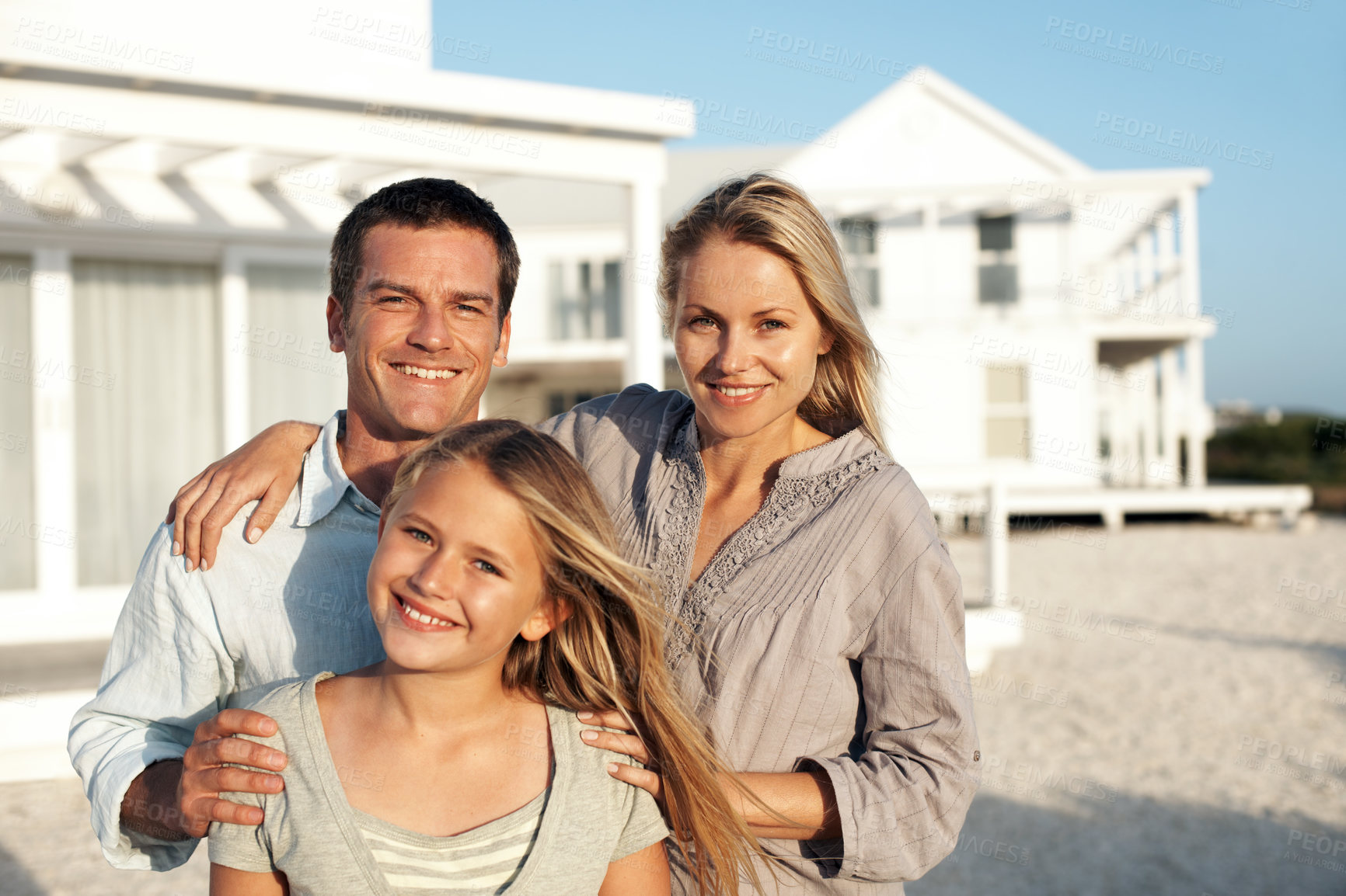 Buy stock photo Portrait, holiday and parents at house with child, bonding and weekend at seaside retreat. Smile, people and daughter at accommodation for travel, family getaway and tropical vacation at beach resort