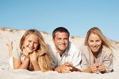 Buy stock photo Portrait, parents and relax with child at beach for love, adventure and bonding together on holiday. Space, people or rest at sea with daughter, connection and happiness on sand for tropical vacation