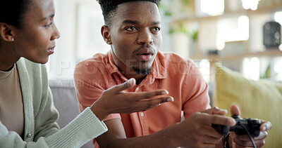 Buy stock photo Attention, black couple and man playing games in home living room for distraction or ignore. Concentration, frustration and gamer person on sofa in apartment with partner for avoid or disregard