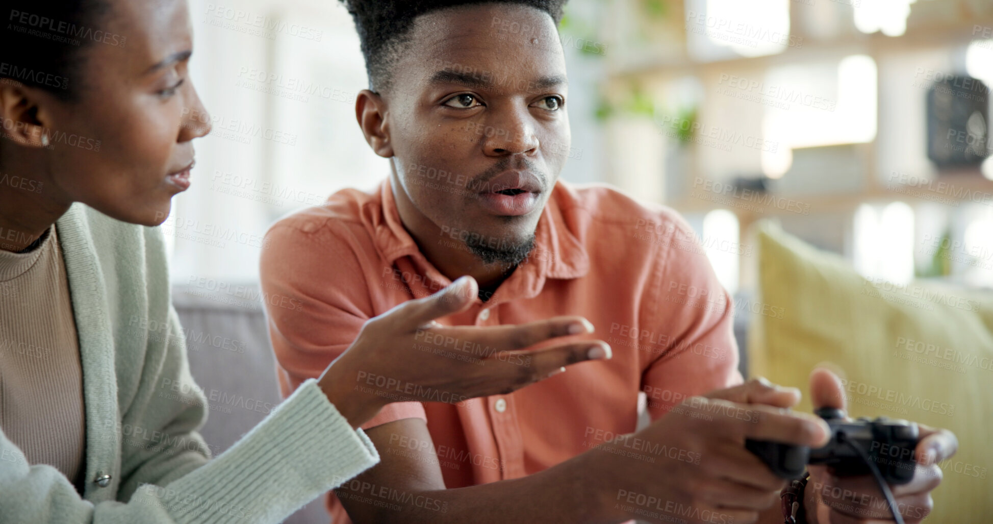 Buy stock photo Attention, black couple and man playing games in home living room for distraction or ignore. Concentration, frustration and gamer person on sofa in apartment with partner for avoid or disregard