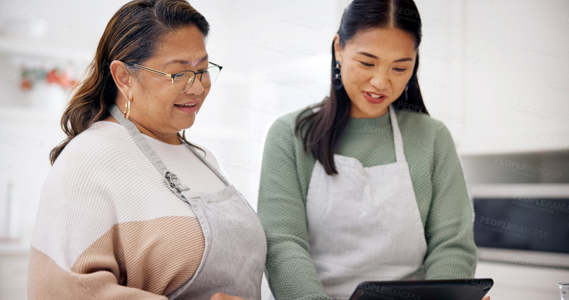 Buy stock photo Tablet, cooking and search with senior mother and daughter in kitchen for learning, recipe and blog. Family, baking and women with digital tech in home for meal prep, help and online tutorial