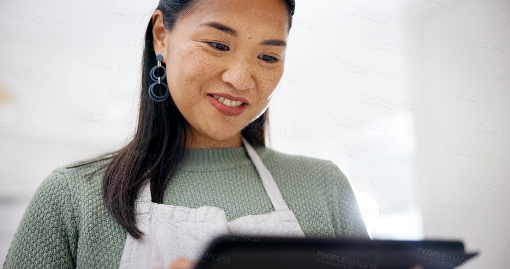 Buy stock photo Smile, tablet and woman in kitchen for recipe, cooking tutorial or digital app for meal prep. Blog, tech and reading in home for nutrition info, website or social media for diet guide or tips