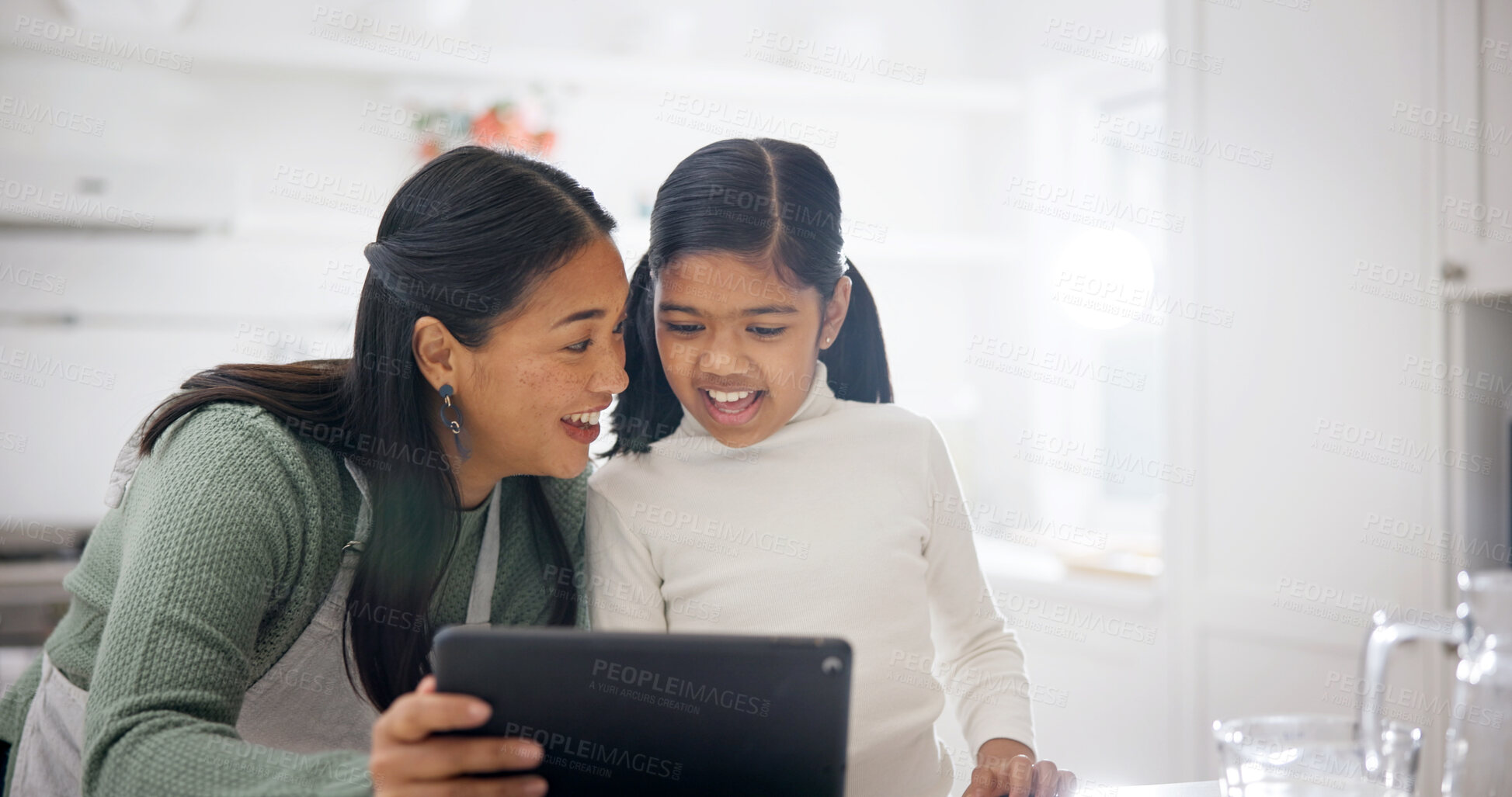 Buy stock photo Daughter, happy and mom with tablet in kitchen of home for child development or learning. App, love and smile with curious girl and single parent woman in apartment for bonding or online streaming