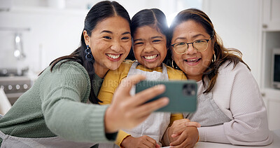 Buy stock photo Selfie, mom or grandma with child in kitchen for photography, memory or baking together in home. Smile, mother and grandmother with daughter or junior baker for generation moment or picture in house