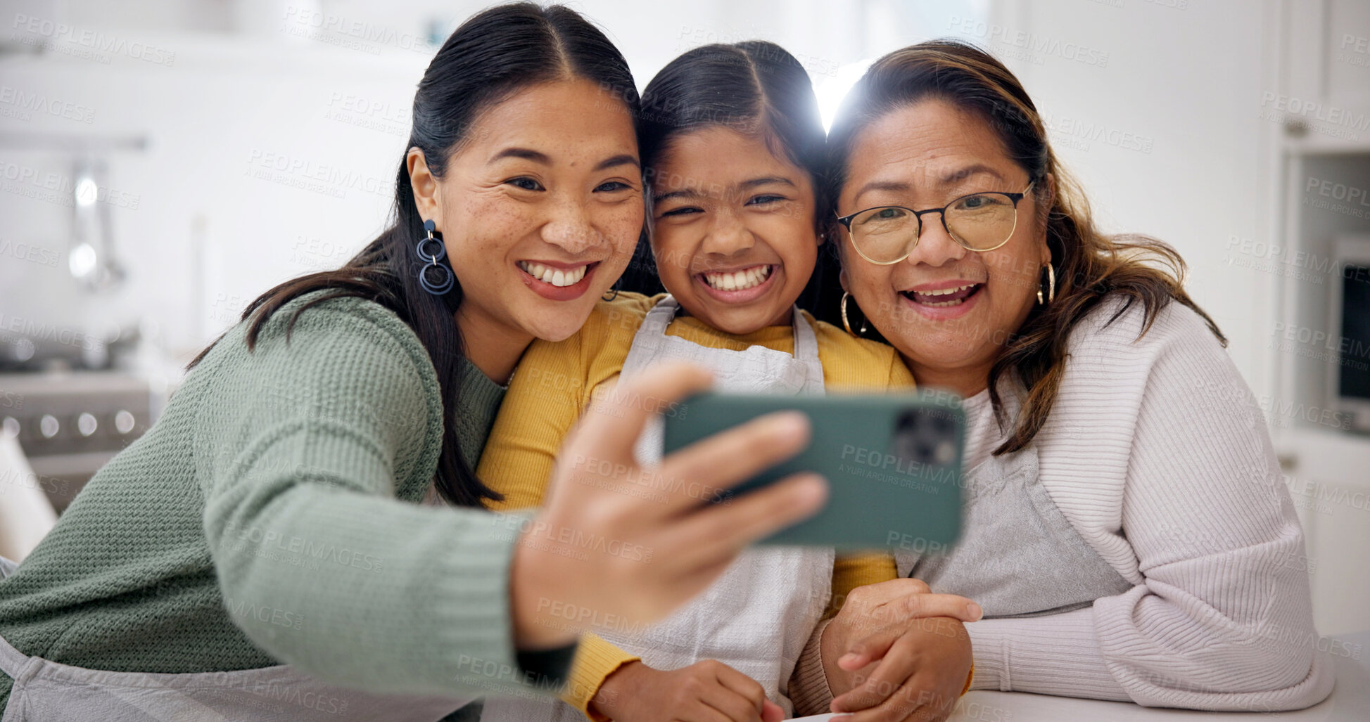 Buy stock photo Selfie, mom or grandma with child in kitchen for photography, memory or baking together in home. Smile, mother and grandmother with daughter or junior baker for generation moment or picture in house