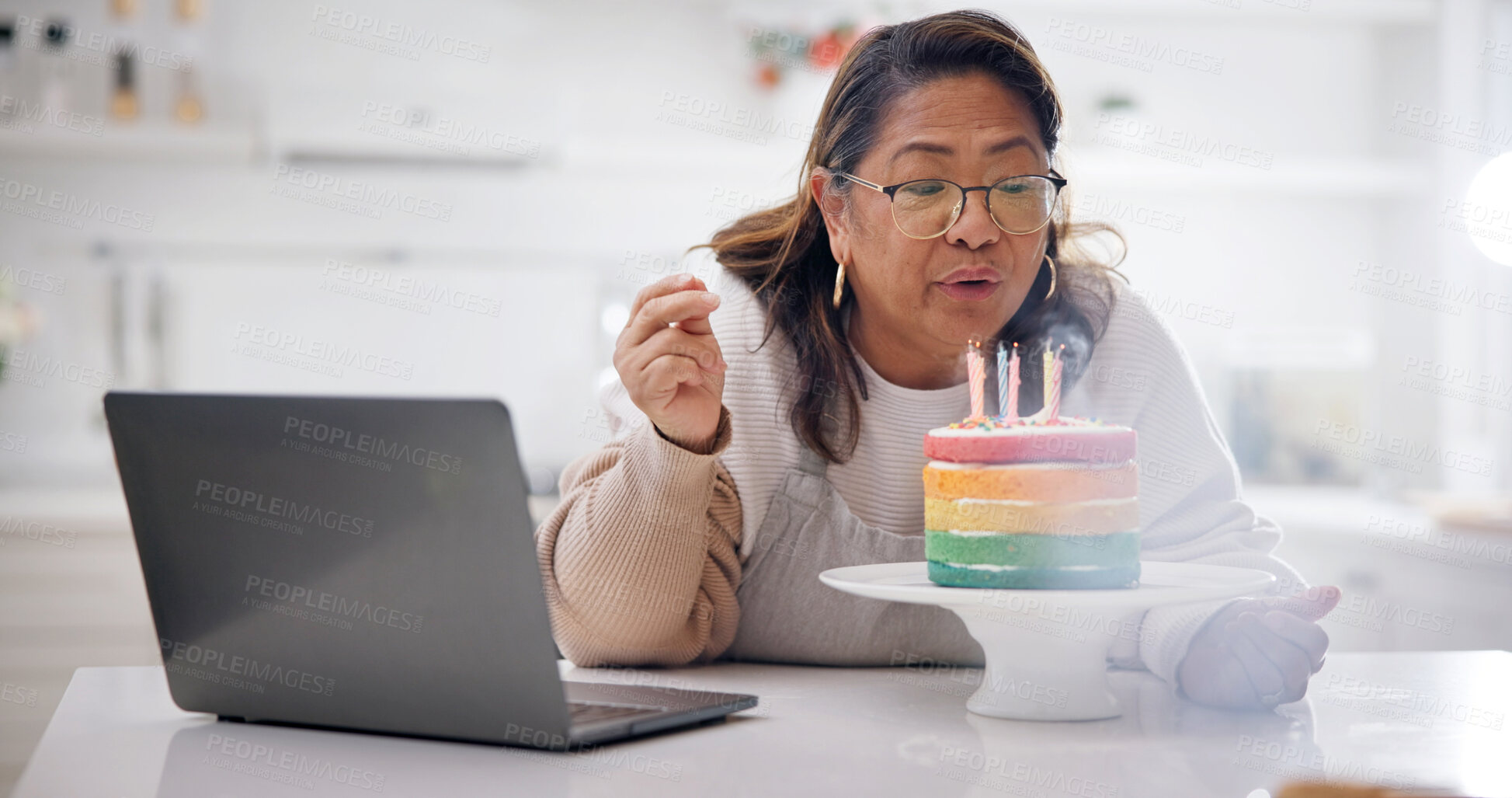 Buy stock photo Video call, laptop or old woman in home with birthday cake, connection or candle blow in online event. Digital, space or senior person with tech, dessert decor or special moment in remote celebration